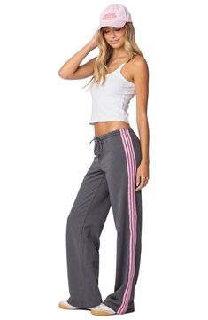 Sporty stripes trail the sides of these wide-leg cotton-blend sweatpants topped with a comfortable elasticized drawstring waist. Elastic/drawstring waist 50% cotton, 50% polyester Machine wash, dry flat Imported Striped Sweatpants, Adidas Sweatpants, Swimwear Dress, Womens Loungewear, Side Stripe, Drawstring Pants, Womens Sweatpants, S Models, Jogger Pants