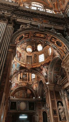 the inside of an ornate building with many windows