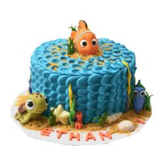 a birthday cake with an image of nemo and fish on it's side