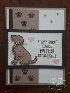 a card with a dog and paw prints on the front, which says best friend leaves a paw print on your heart