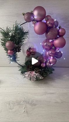 an image of christmas decorations on the floor with lights and ornaments around it, as well as a video about how to use them