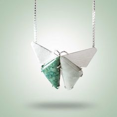 Beautiful origami inspired silver necklace enhanced by two shades of Guatemalan Jade; simplistic and interesting. Leaf Green & Mint Jade Sterling Silver (925) Length Chain: 18" Measurements Pendant: H: 3cm, L: 4cm Beautiful Origami, Origami Necklace, Origami Butterfly, Green Mint, Leaf Green, Jade Jewelry, Butterfly Necklace, Silver 925, Origami