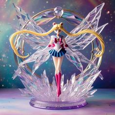 a figurine that is standing on top of a glass stand in front of a colorful background