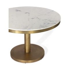 a white and gold table with a marble top on a metal base, against a white background