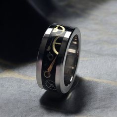 This exquisite handmade ring features a durable 6mm stainless steel core, ensuring longevity and strength. The unique design incorporates a 4mm authentic Swiss watch movement parts inlay, elegantly encased in high-quality resin, creating a striking visual effect. Each piece is meticulously crafted, making it a perfect accessory for those who appreciate fine craftsmanship and distinctive style. Ideal for both casual and formal occasions, this ring is a statement of sophistication and individualit Steampunk Casual, Friendship Ring, Friendship Rings, Swiss Watch, Watch Movement, Swiss Watches, Visual Effects, Engagement Wedding, Rings Statement