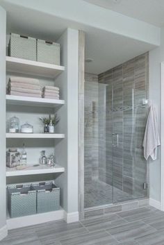 a walk in shower sitting inside of a bathroom