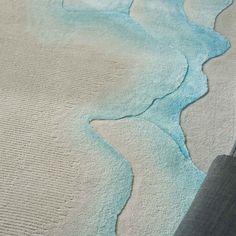 an area rug with waves on it