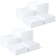 three white boxes are stacked on top of each other in the shape of cubes