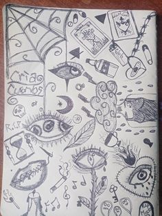 an open notebook with drawings on it