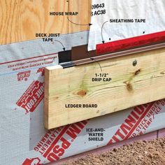 an image of the side of a house being built with insulation tape and wood planks