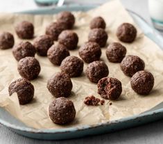 chocolate balls are on a baking sheet ready to be eaten