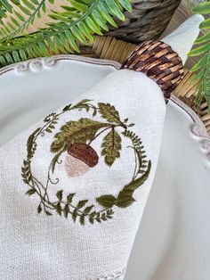 Bring the warmth of autumn to your Thanksgiving table with our exquisitely embroidered linen napkins. Featuring a detailed acorn and leaves design, these napkins are perfect for adding a touch of rustic charm to your fall gatherings. Each napkin is crafted from high-quality linen, measuring approximately 18"x18", and finished with a classic hemstitch border. These napkins are not only a beautiful addition to your table setting but also make a thoughtful gift for Thanksgiving hosts, fall weddings, or any autumn-inspired event. The natural ivory color complements any decor, while the intricate embroidery showcases the beauty of the season. Product Details:  *Size: 18"x18"  *Color: Ivory with fall-themed acorn and leaves embroidery *Material: 100% linen with hemstitch finishing *Perfect for T Acorn Embroidery, Autumn Sewing, Embroidered Linen Napkins, Fall Linen, Fall Embroidery, Bow Embroidery, Fall Dinner Party, Thanksgiving Table Decor, Hosting Thanksgiving