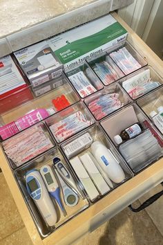 a drawer filled with medical supplies on top of a table