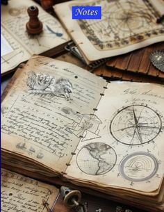 an open book sitting on top of a table covered in lots of old papers and other items