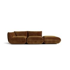 a brown couch sitting on top of a white floor