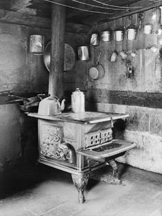 an old fashioned stove in a rustic kitchen