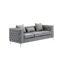 an image of a couch with pillows on it's back and side cushions in grey color