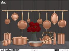 a set of copper pots and pans with red flowers