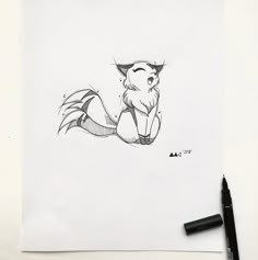 a drawing of a fox sitting on top of a piece of paper next to a marker