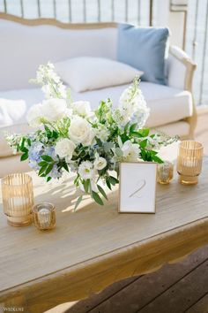 a table with flowers and candles on it