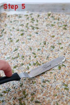 a person is cutting seeds with a knife