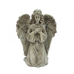 an angel statue with its hands folded in prayer