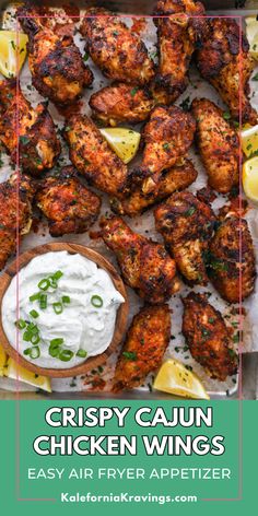 crispy cajun chicken wings with ranch dip and lemon wedges on the side