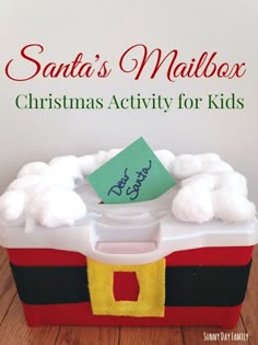 the santa's mailbox christmas activity for kids is made with cotton balls and felt