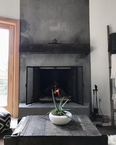 a living room with a fire place in the fireplace