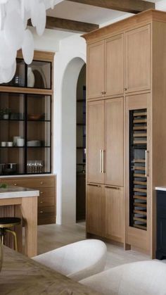 a kitchen with wooden cabinets and white counter tops