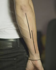 a person with a tattoo on their arm holding onto the other side of his arm