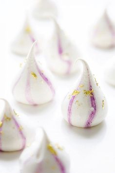 small white and purple candies with gold sprinkles