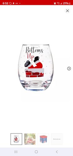 a wine glass with the words,'bottoms up'and a santa hat on it