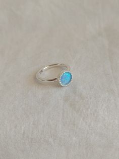 It is a simple and delicate silver ring with a beautiful opal stone. Perfect as a birthday gift with a birthstone. Mother's daughter's ring Handmade sterling silver ring with  Opal stone set like a crown. A sweet and simple ring or everyday wear. Perfect gift for someone you love. Size to order: 2- 13 U.S Stone size: 6 mm. For more stones, and birthstones please convo me.   What is a lab-created opal? A lab-created opal is an opal, grown in a lab setting, that has the same exact chemical composi Opal Birthstone Ring In White Gold, Minimalist Opal Ring With Bezel Setting As Gift, Opal Gemstone Ring As A Gift, Opal Crystal Ring With Birthstone For Gifts, Opal Birthstone Crystal Ring As Gift, Dainty Opal Ring Gift, Dainty Opal Ring With Birthstone In Round Band, Dainty Blue Opal Ring For Gift, Dainty Adjustable Opal Ring Gift