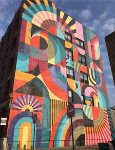 a large colorful building painted on the side of it