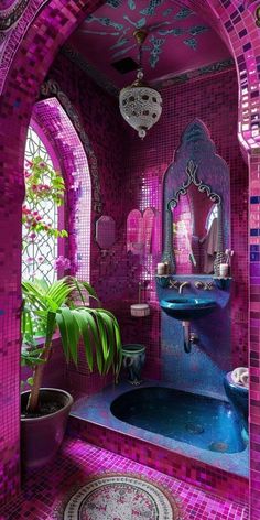 a bathroom with pink and blue tiles on the walls, sink and mirror in it