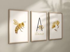 three framed art prints with the letter a, bee and flower