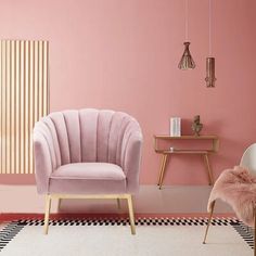 two chairs in a pink room with black and white checkered rugs on the floor