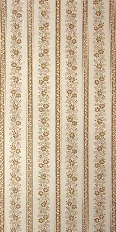 the wall paper is striped with gold and white designs