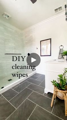 a bathroom with tile flooring and white walls is featured in the video diy cleaning wipes