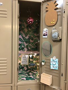 the locker is decorated with pineapples and magnets on it's doors