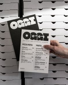 a person holding up a piece of paper with the word ocai on it