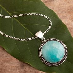 Glowing bright and mystical like the Andean moon, amazonite is said to bring luck in every hope and dream. Fabiana Quispe encases the natural gem in sterling silver featuring burnished accents in a design that is filled with enchanted minimalism. Silver Amazonite Round Jewelry, Round Amazonite Jewelry With Natural Stones, Artisan Amazonite Gemstone Jewelry, Spiritual Turquoise Moonstone Jewelry, Silver Larimar Jewelry For Healing, Silver Amazonite Jewelry With Natural Stones, Bohemian Silver Amazonite Necklaces, Amazonite Gemstone Pendant Jewelry, Spiritual Silver Amazonite Necklaces