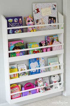 a white book shelf filled with lots of books