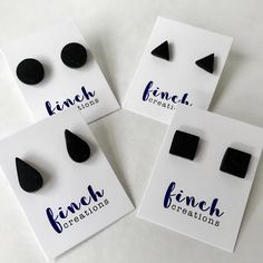 three pairs of black earrings are shown on a white card with the words lunch creations written below them