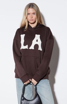 The Vintage Field LA Hoodie from PacSun offers a blend of laid-back style and comfort. Featuring an attached hood, long sleeves with dropped shoulders, an LA-stitched front patch, a convenient kangaroo pocket, and an oversized fit, this hoodie is perfect for relaxed days with a touch of West Coast flair.Solid color hoodieSoft fleece liningAttached hoodLong sleevesDropped shouldersLA front patchesKangaroo pocketRibbed cuffs and hemOversized fit60% cotton, 40% polyesterMachine washableModel is wearing a size smallModel measurements: 5’8” height, 31” bust, 23” waist, 36” hips PacSun Womens Vintage Field LA Hoodie - Brown size Small Pacsun Hoodie, Brown Hoodie, Women Hoodies Sweatshirts, Laid Back Style, Pacsun, Hoodies Womens, Vintage Shops, Sweatshirts Hoodie