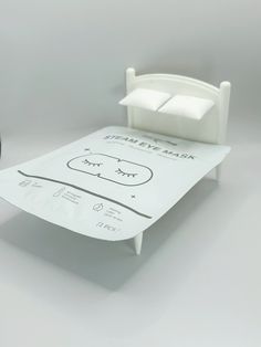 a bed made out of toilet paper and a clock