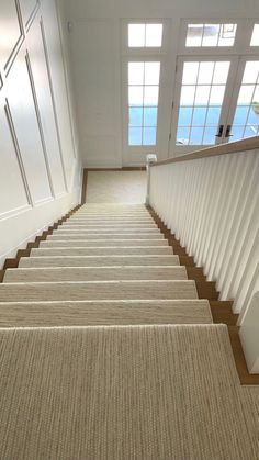 an image of a staircase with carpet on it