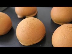 there are several round doughnuts sitting on the table and ready to be baked