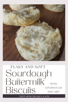 some biscuits are sitting on top of a wooden board with the words, flavy and soft sourdough buttermilk biscuits